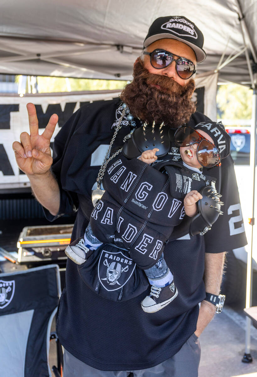The "Hangover Raider" in tailgating before the first half of the Raiders versus the K ...