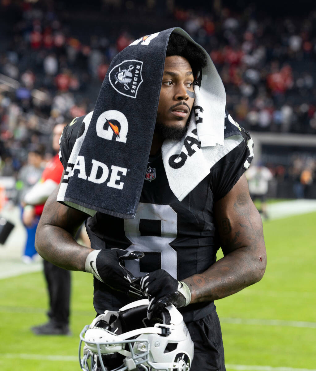 Raiders running back Josh Jacobs (8) walks off the field after losing against the Kansas City C ...