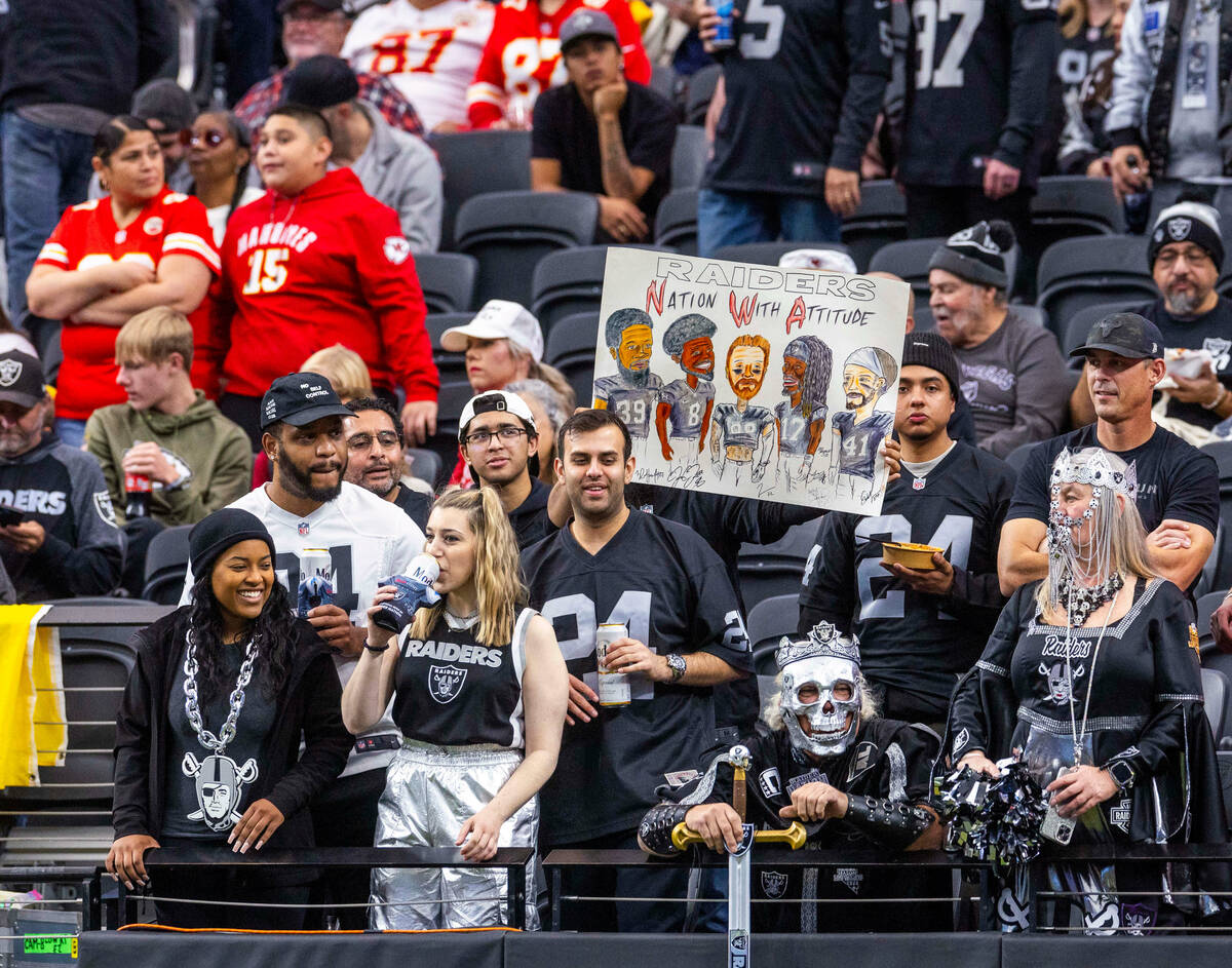 A Raiders fan holds a poster in the first half of their NFL game against the Kansas City Chiefs ...