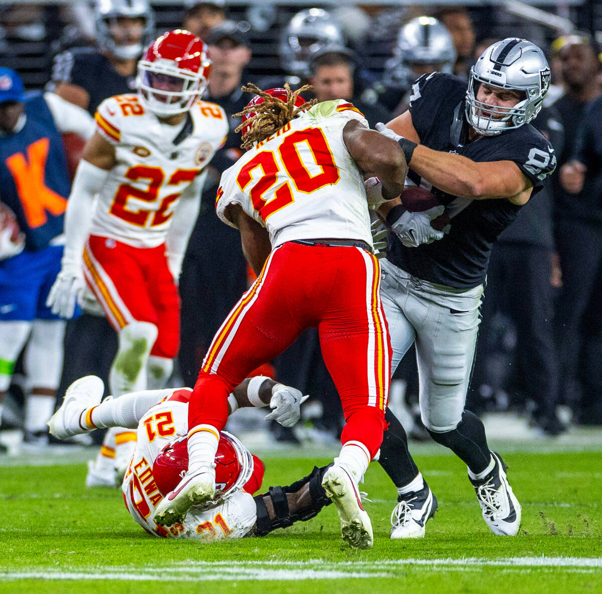 Raiders tight end Michael Mayer (87) collides with Kansas City Chiefs safety Justin Reid (20) a ...