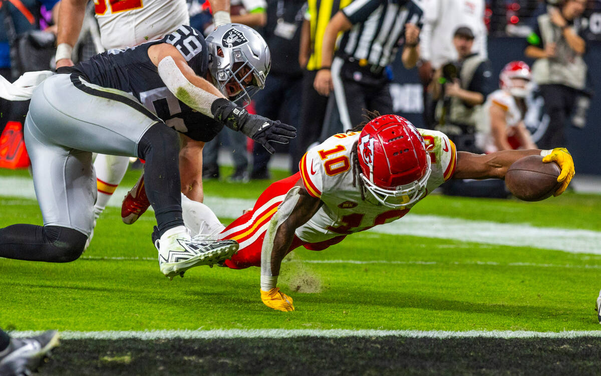 Kansas City Chiefs running back Isiah Pacheco (10) extends the ball towards the goal line as Ra ...