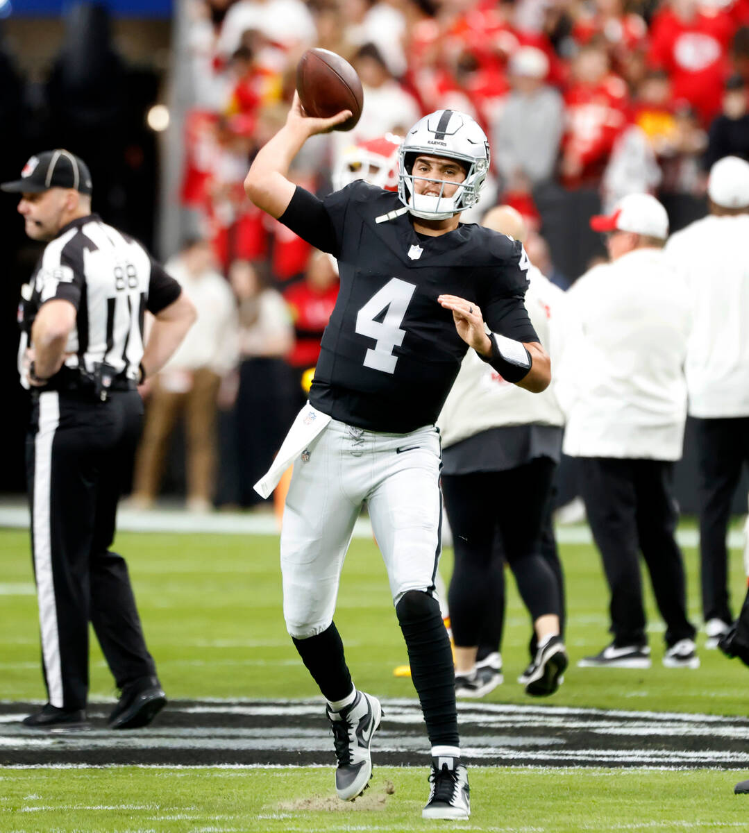 Raiders quarterback Aidan O'Connell (4) warms up to face Kansas City Chiefs during an NFL footb ...