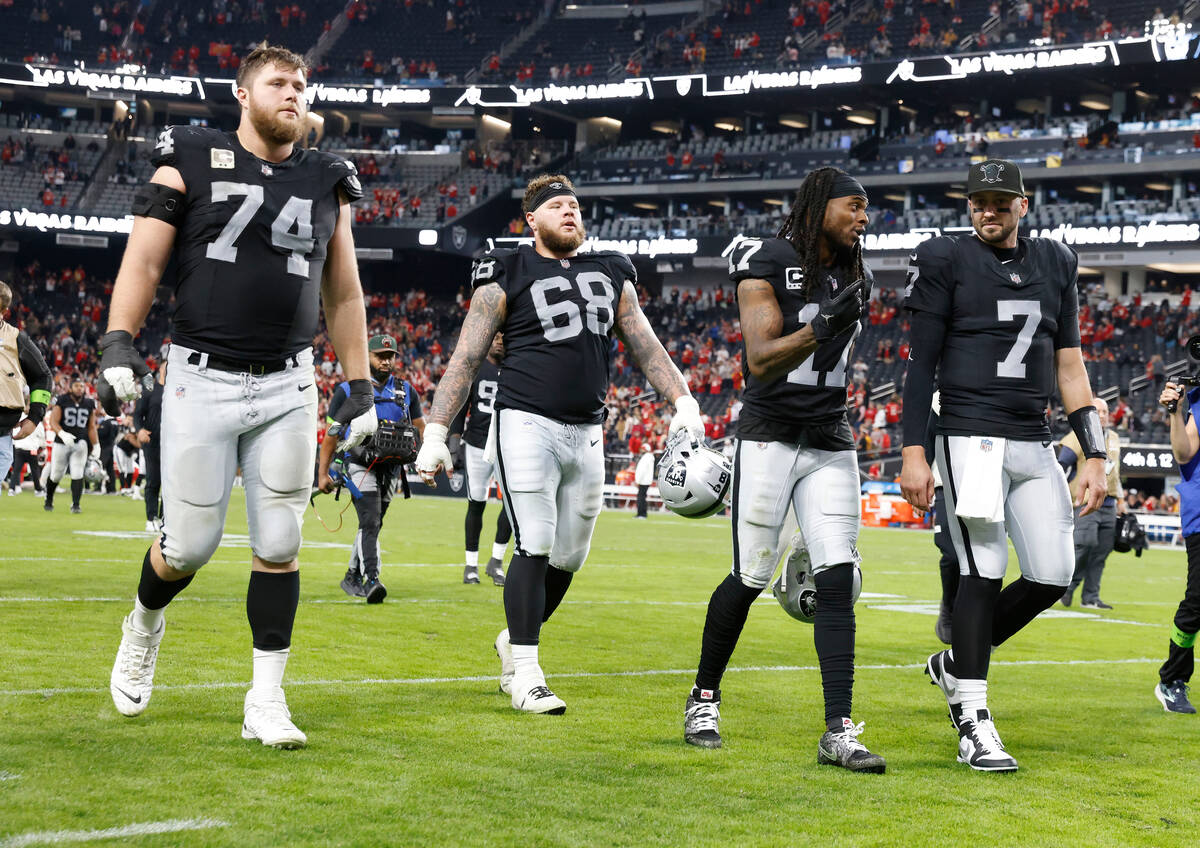Raiders offensive tackle Kolton Miller (74) Raiders center Andre James (68) Raiders wide receiv ...