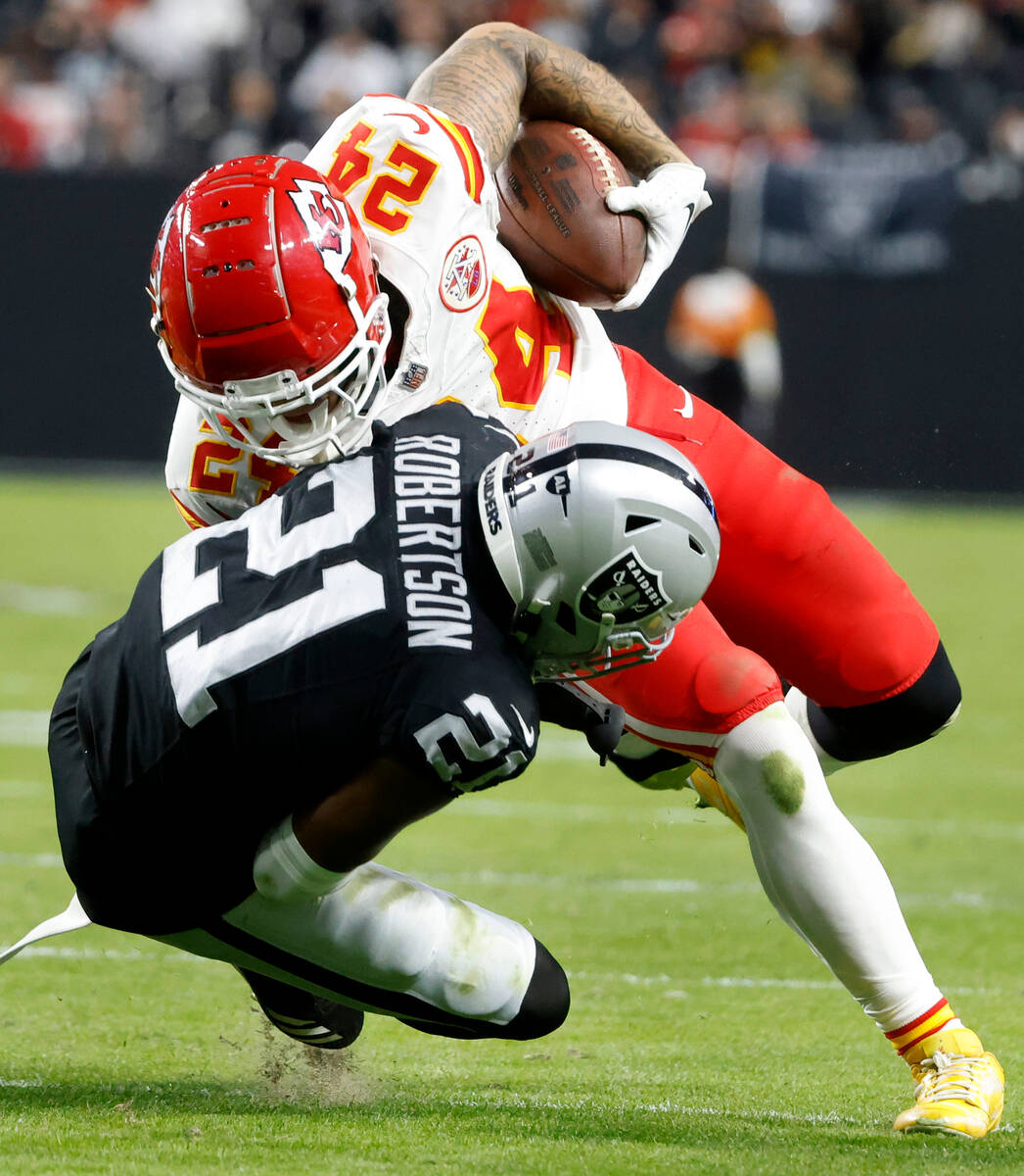 Raiders cornerback Amik Robertson (21) takes down Kansas City Chiefs wide receiver Skyy Moore ( ...