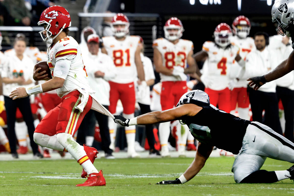 Raiders defensive tackle Jerry Tillery (90) tries to pull Kansas City Chiefs quarterback Patric ...