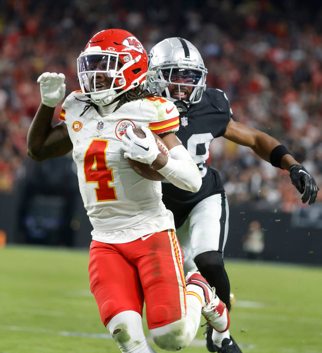 Kansas City Chiefs wide receiver Rashee Rice (4) gets past Raiders cornerback Nate Hobbs (39) a ...