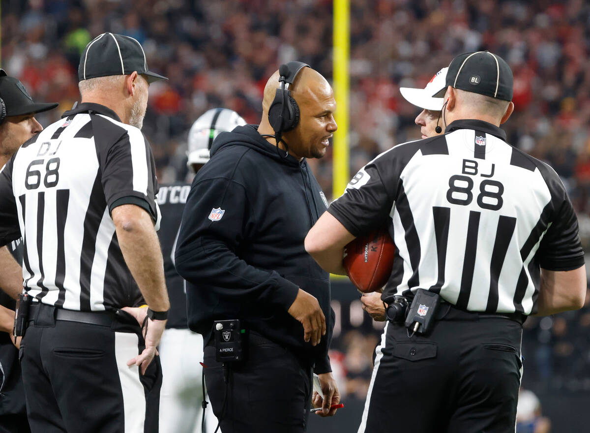 Raiders Interim Coach Antonio Pierce argues with officials about a call during the second half ...