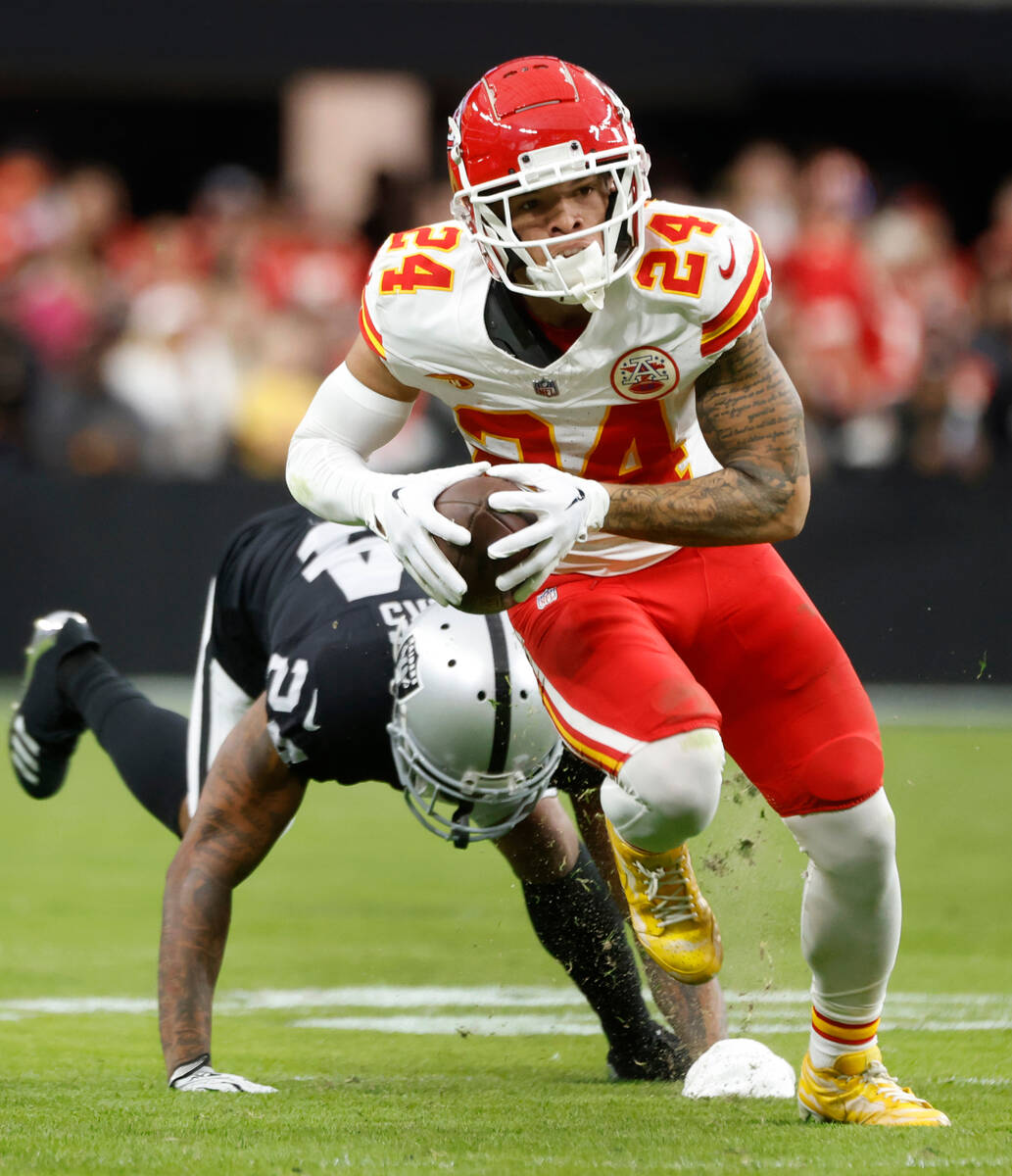 Kansas City Chiefs wide receiver Skyy Moore (24) runs with the ball past Raiders cornerback Mar ...