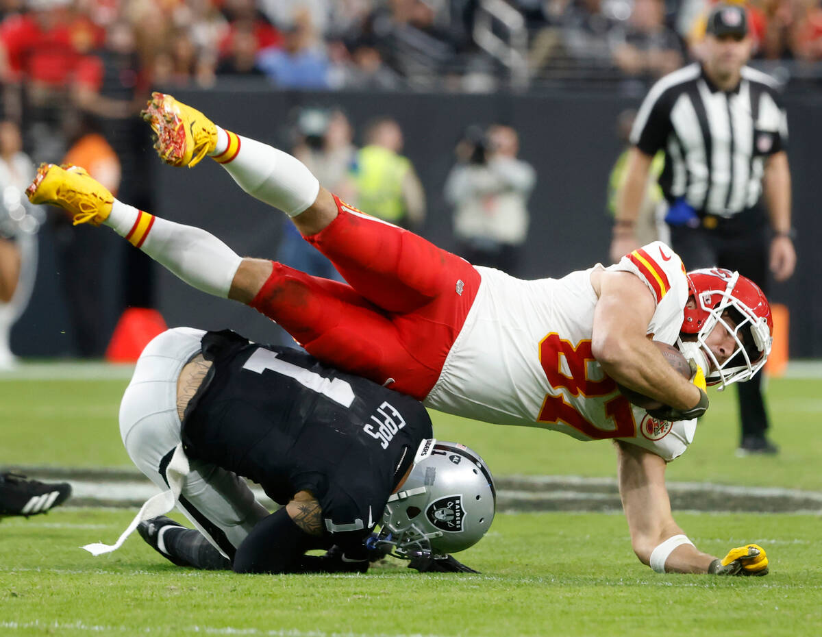 Raiders safety Marcus Epps (1) tackles Kansas City Chiefs tight end Travis Kelce (87) during th ...
