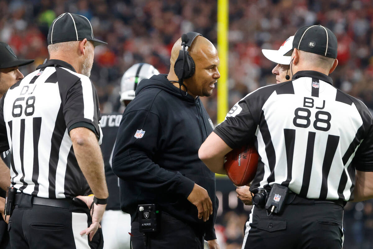 Raiders Interim Coach Antonio Pierce argues with officials about a call during the second half ...
