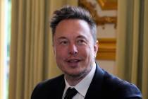 FILE - Twitter, now X. Corp., and Tesla CEO Elon Musk poses before his talks with French Presid ...