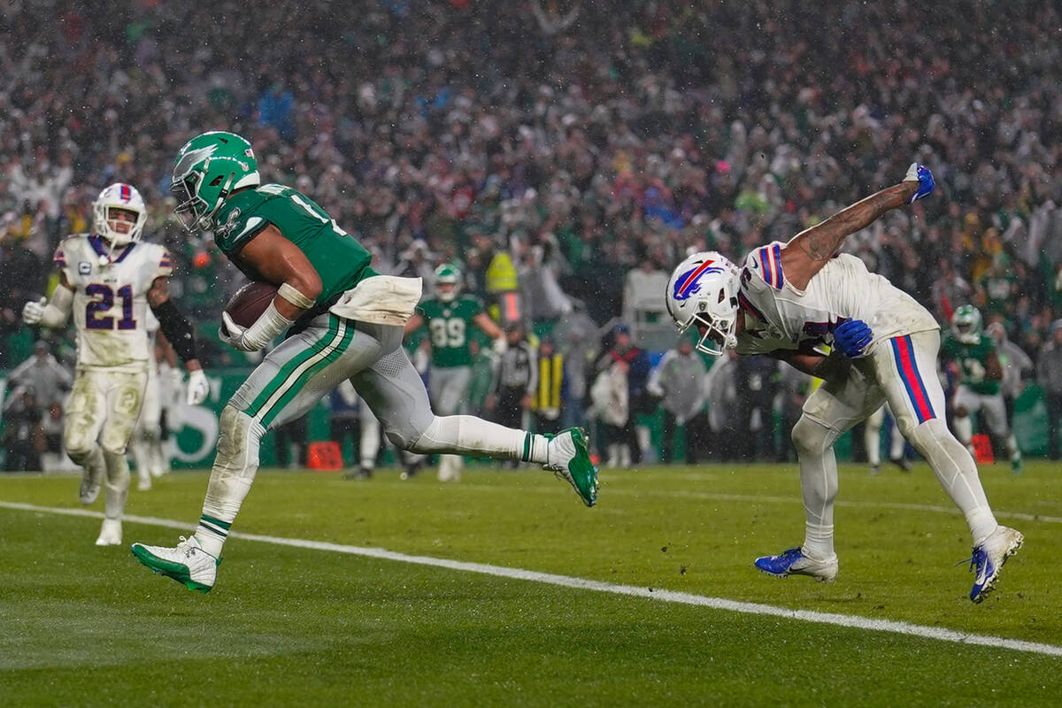 Philadelphia Eagles quarterback Jalen Hurts scores the game winning touchdown against the Buffa ...