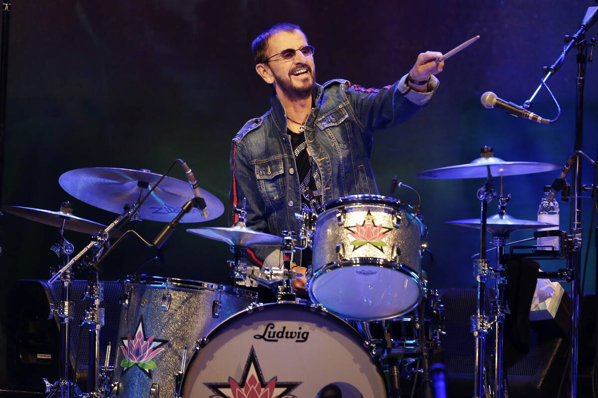 FILE - Ringo Starr plays as part of a concert celebrating the 50th anniversary of Woodstock in ...