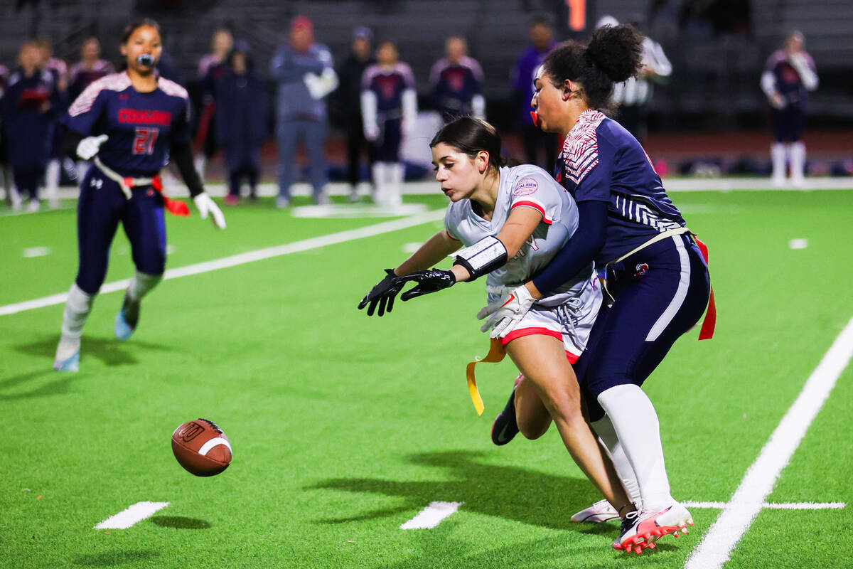 Coronado’s Samia Linton-Rivera (22) holds back a Liberty player from catching the ball d ...