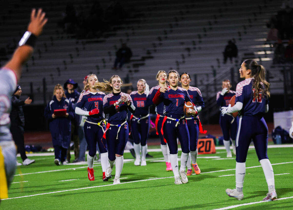 Coronado’s Maci Joncich (1) leads her team out onto the field during a flag football gam ...