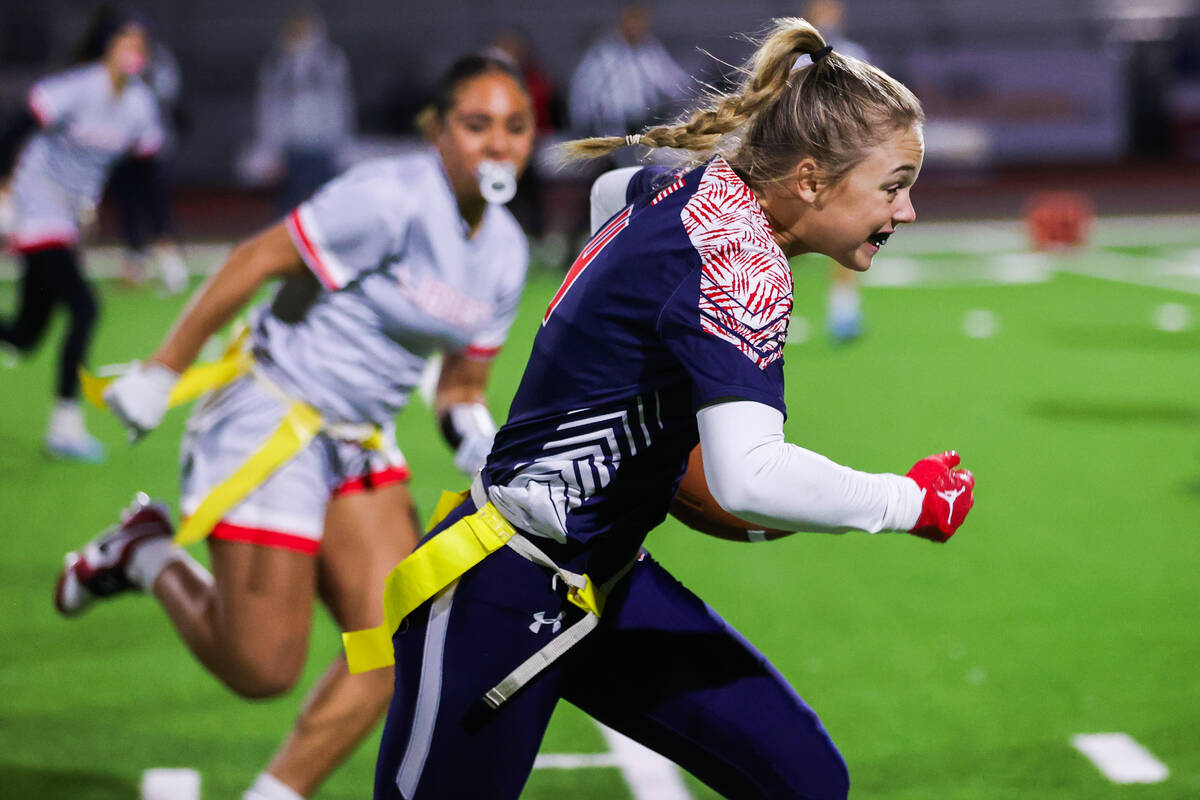 A Coronado player moves the ball down the field during a flag football game between Coronado Hi ...
