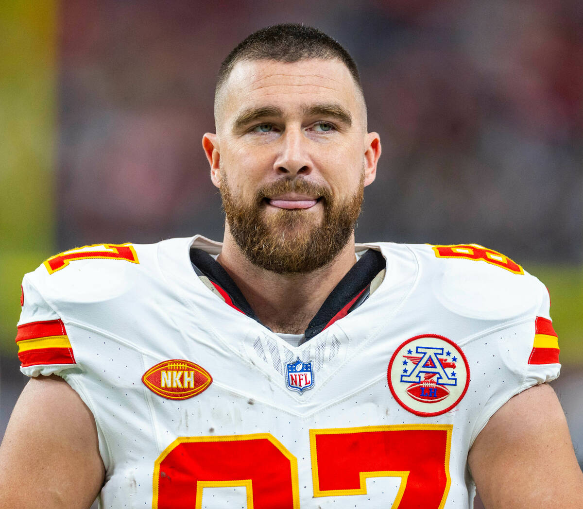 Kansas City Chiefs tight end Travis Kelce (87) stands with his tongue out on the sideline again ...