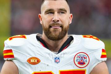 Kansas City Chiefs tight end Travis Kelce (87) stands with his tongue out on the sideline again ...