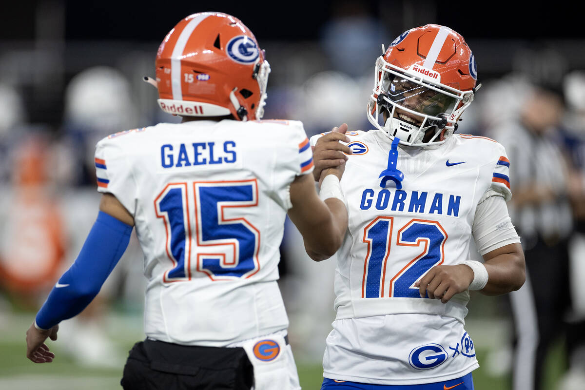 Bishop Gorman quarterback Micah Alejado (12) is tagged out of his final game by incoming starti ...