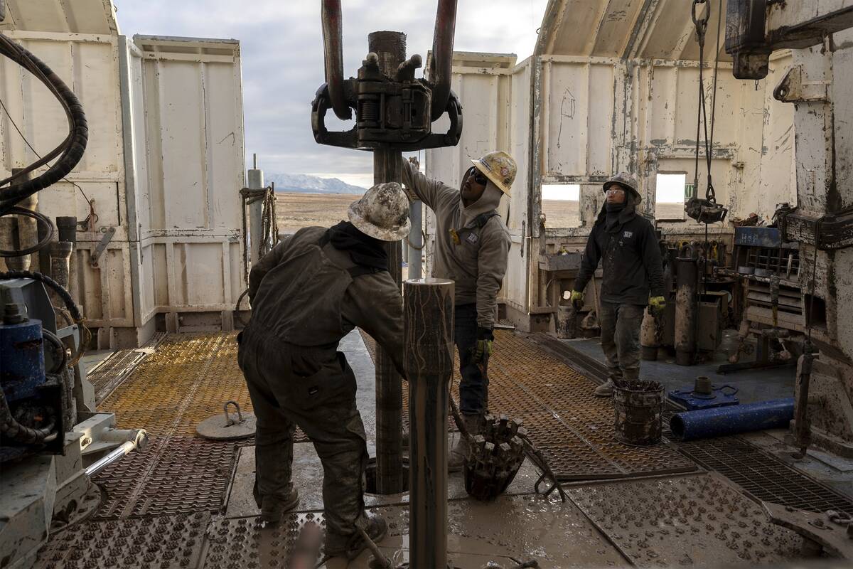 Rig operators connect drills that will plunge underground to access reservoirs of heat, Sunday, ...