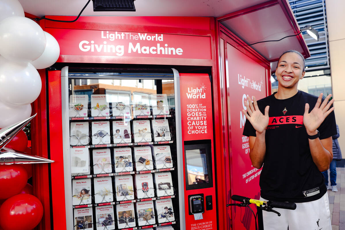 Las Vegas Aces player Kiah Stokes purchases items from The Giving Machine, a “vending ma ...