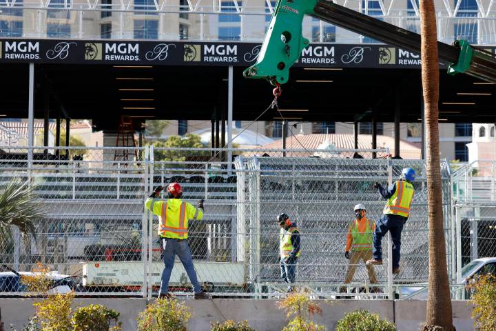 Workers began removing fencing around the Formula One race track near the Fountains of Bellagio ...