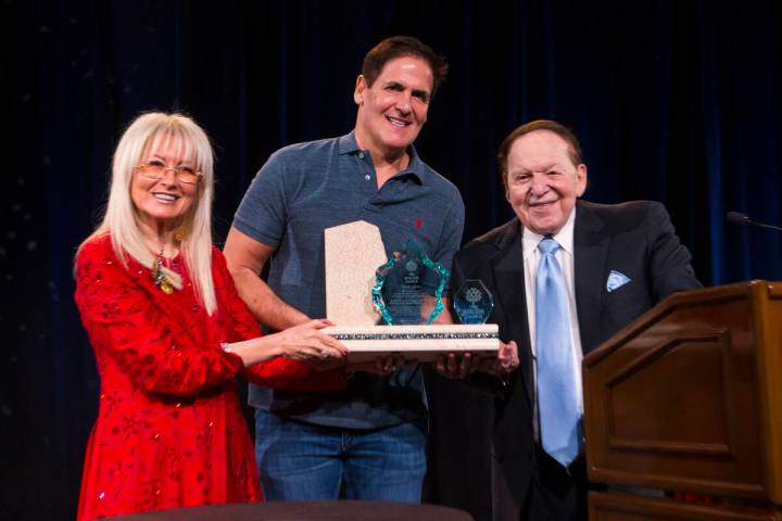 Entrepreneur Mark Cuban, center, poses with Dr. Miriam Adelson and Las Vegas Sands Corp. Chairm ...