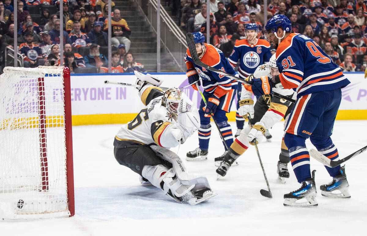 Vegas Golden Knights goalie Logan Thompson (36) is scored on by Edmonton Oilers' Evander Kane ( ...