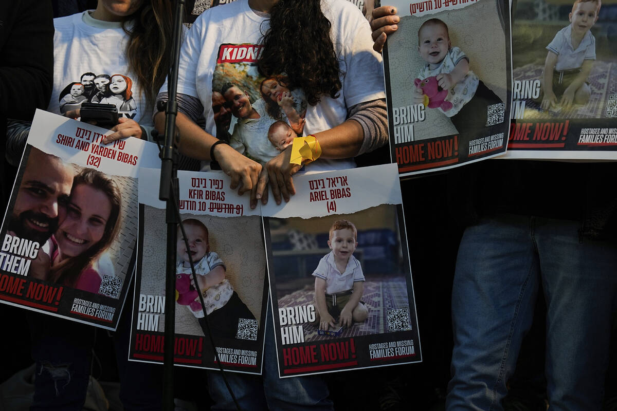 Israeli protesters call for the release of the Bibas family, whose members are being held hosta ...
