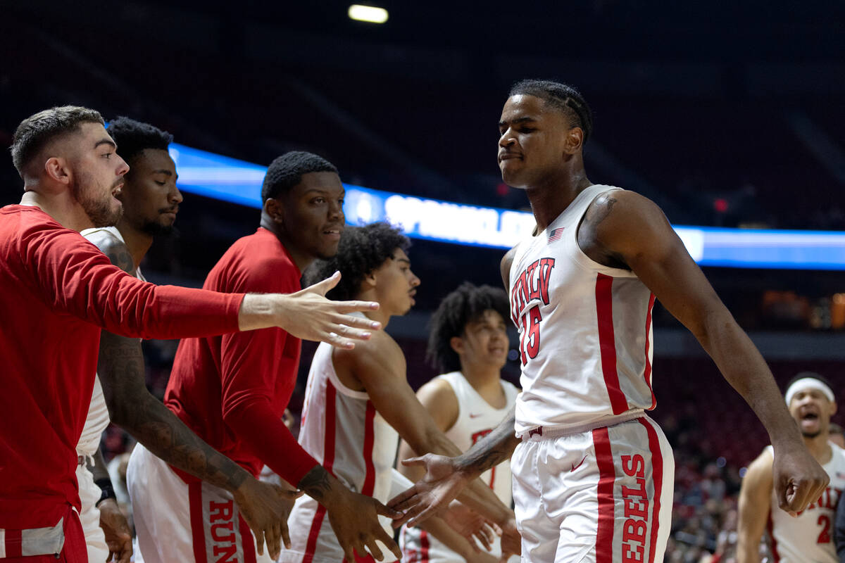 UNLV Rebels guard Luis Rodriguez (15) celebrates at the bench after scoring during the first ha ...