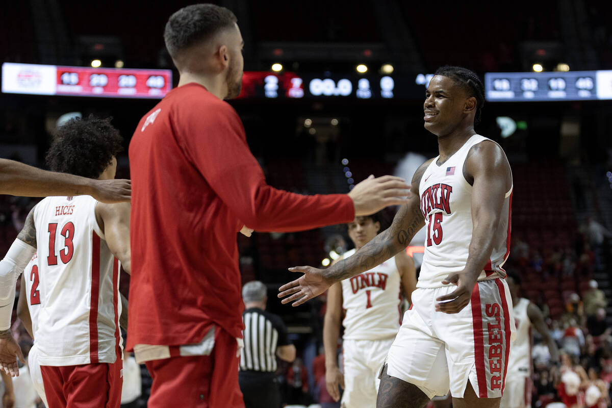 UNLV Rebels guard Luis Rodriguez (15) celebrates with his team after winning an NCAA college ba ...