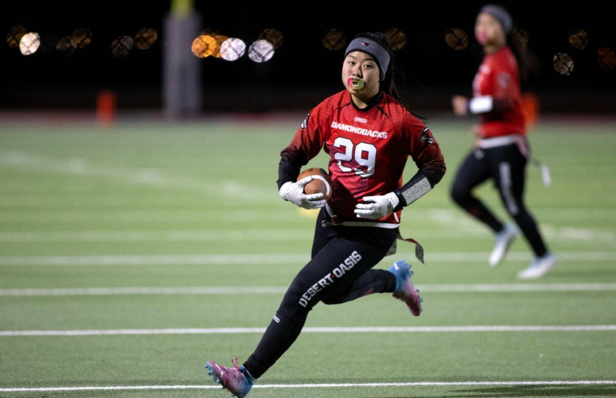 Desert Oasis wide receiver Akiko Higa (29) runs the ball during a high school flag football gam ...