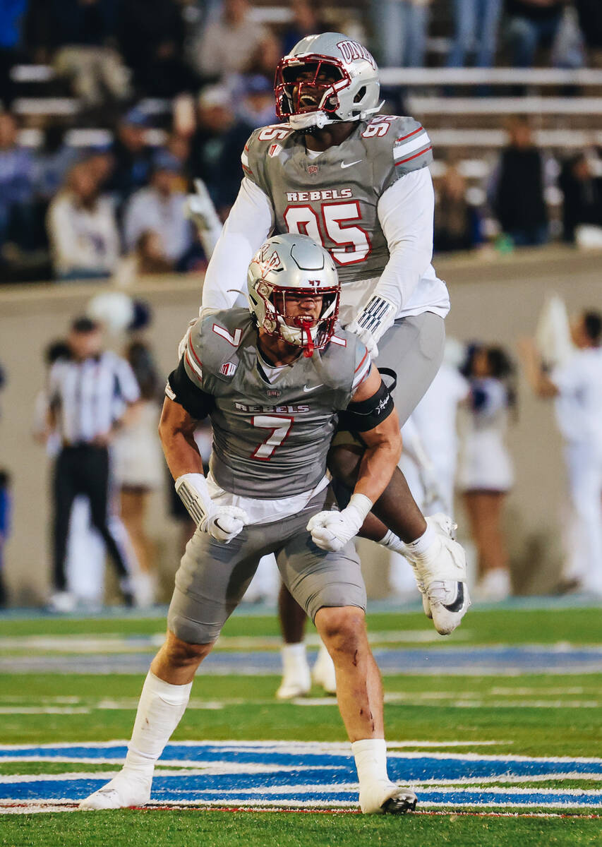 UNLV linebacker Jackson Woodard (7) and UNLV defensive lineman Alexander Whitmore (95) celebrat ...