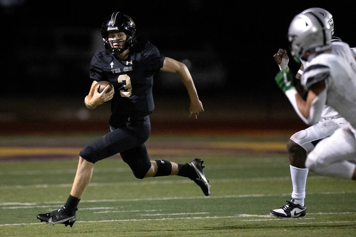 Faith Lutheran quarterback Garyt Odom (3) runs with his kept ball during the first half of a hi ...