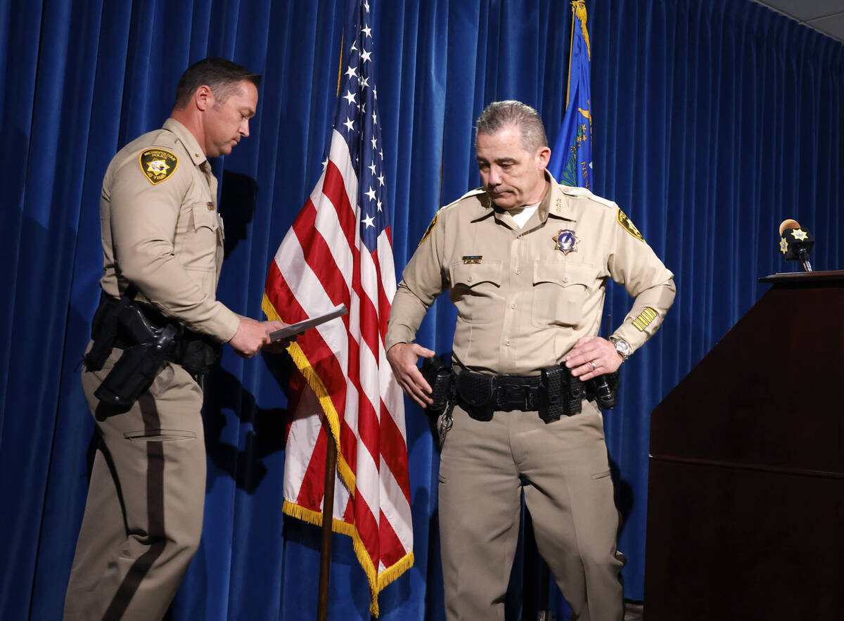 Undersheriff Andrew Walsh, right, leaves the podium after speaking about two Nevada State Troop ...