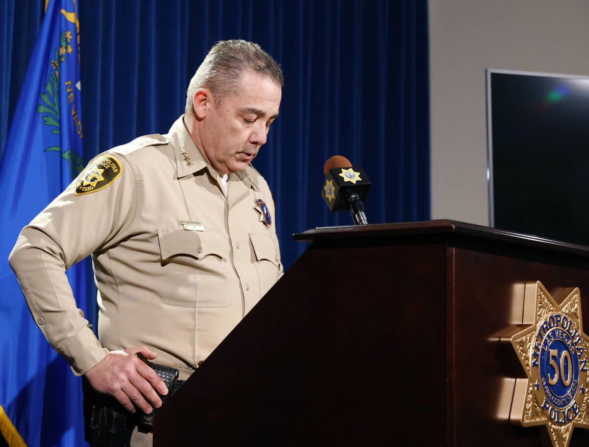 Undersheriff Andrew Walsh, right, pauses as he speaks about two Nevada State Troopers that were ...