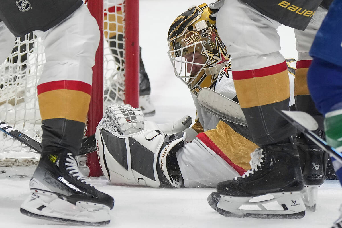 Vegas Golden Knights goalie Adin Hill covers the puck to get a whistle during the first period ...