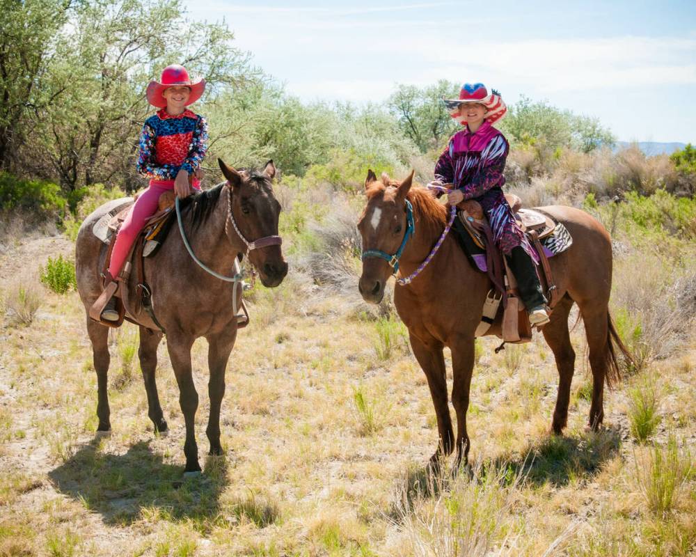 Rhea, left, and Rori Fenner show off their matching all-around saddles from their respective ag ...