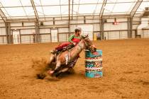 Rori Fenner and Matts Fancy Playgirl "Pink" wrapping their first barrel during competition in W ...