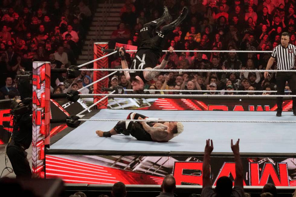 Wrestler Kevin Owens goes airborne over Solo Sikoa during the WWE Monday Night RAW event, Monda ...