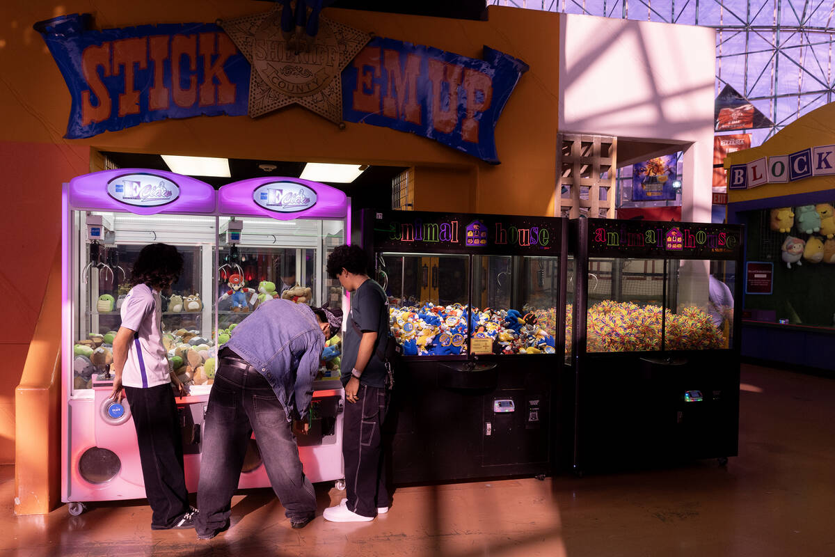 Teens play games to win plush animals in the Adventuredome at Circus Circus on Wednesday, July ...