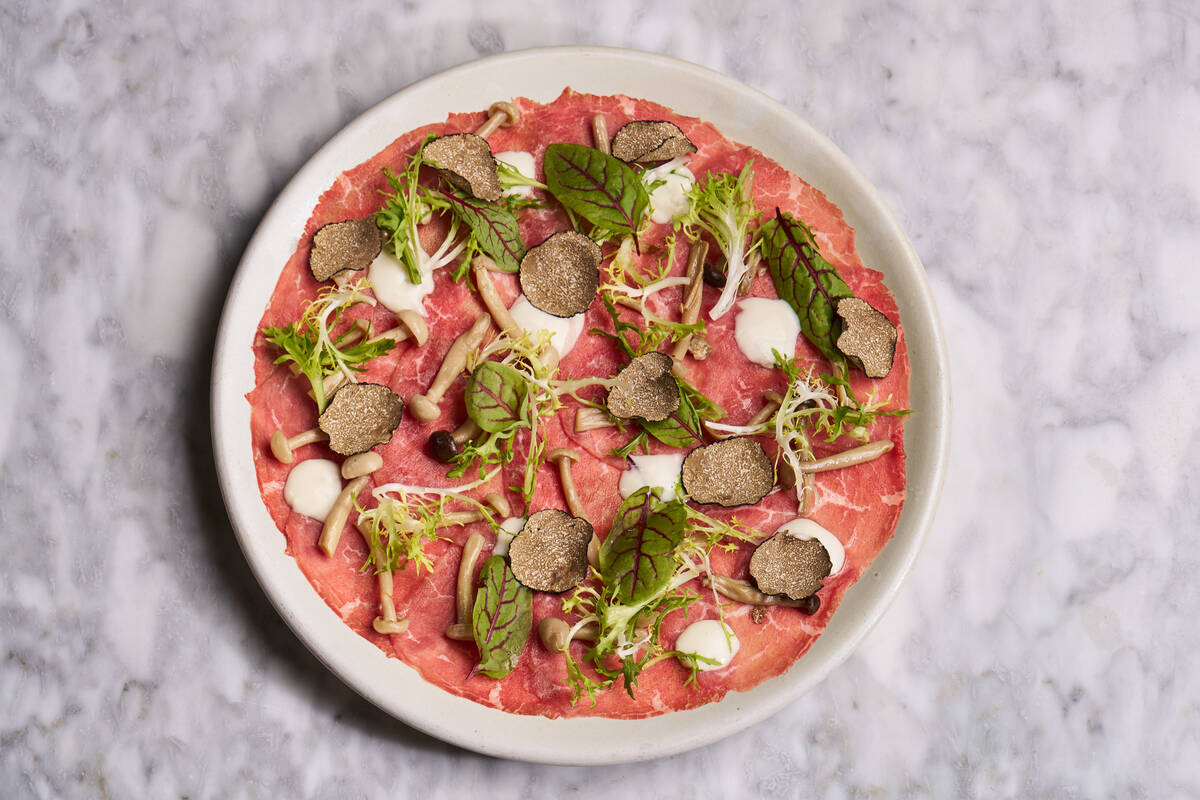 Beef carpaccio with shaved Urbani Burgundy truffles is among the dishes on the fall 2023 prix f ...