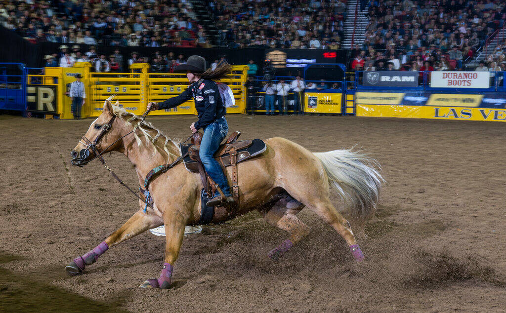 Hailey Kinsel of Cotulla, Texas., navigates a barrel on the way to her winning time in Barrel R ...