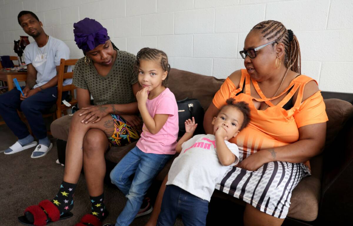 Victoria Mike, second from left, visits with, from left, her brother Davon Parker, nieces Nevae ...