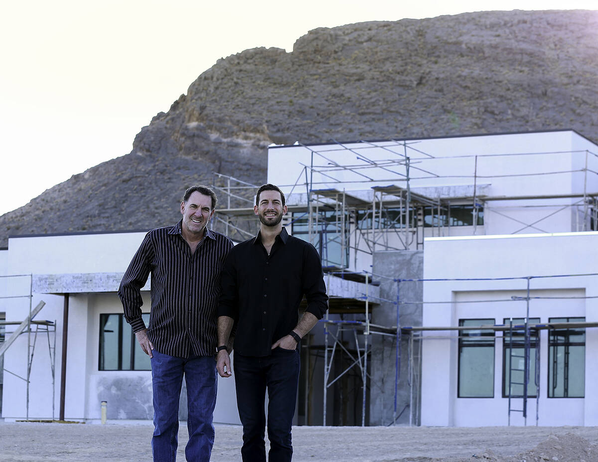 Father-and-son team Ken and Kris Templeton of Templeton Development Corp. stand in front of on ...