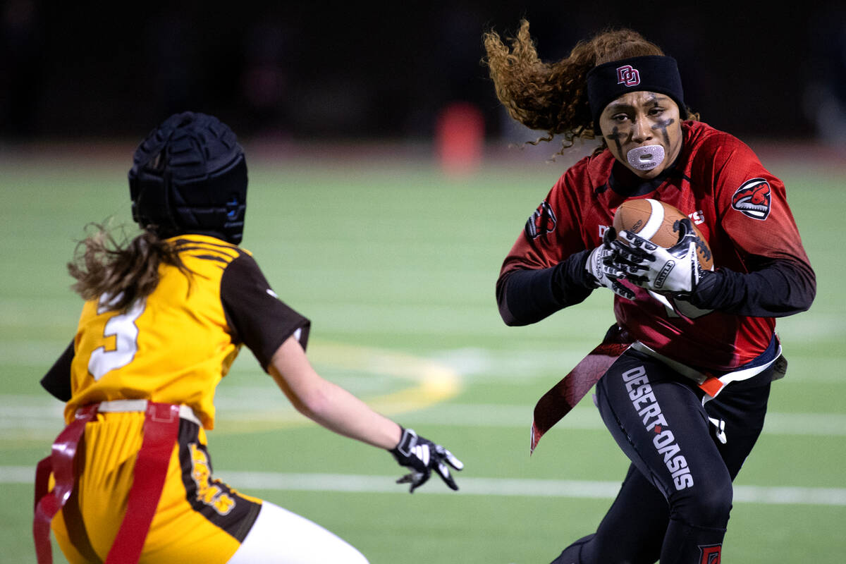 Desert Oasis wide receiver Brooklin Hill (10) runs the ball against Bonanza’s Reagan Cou ...