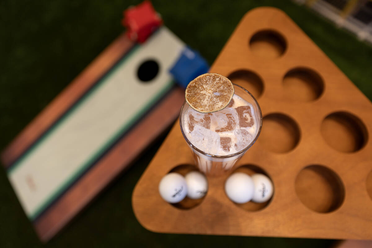 The Pleasure Business cocktail is arranged with yard games in The George at Durango Casino and ...