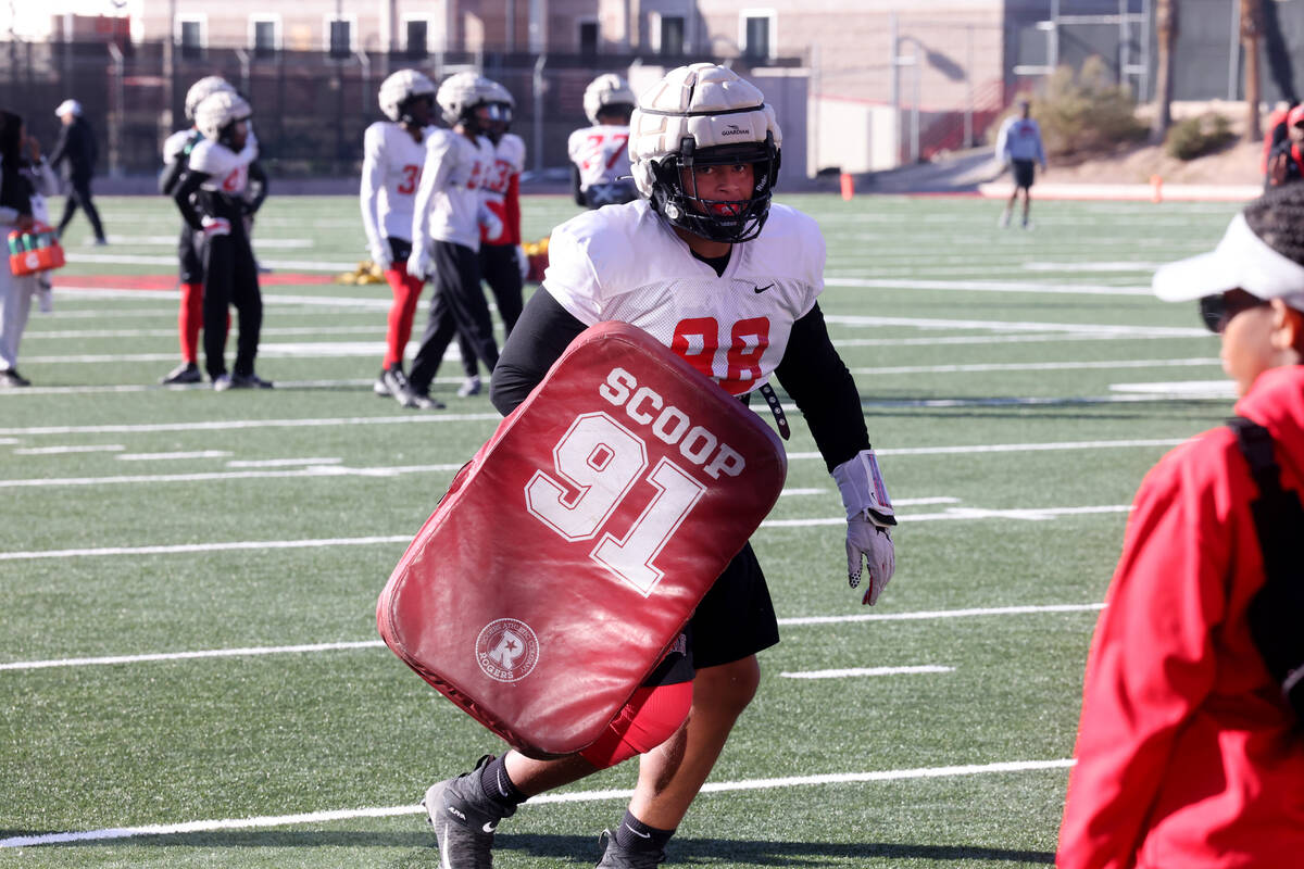 UNLV football walk-on defensive lineman Tatuo Martinson (98) works out during practice at Rebel ...