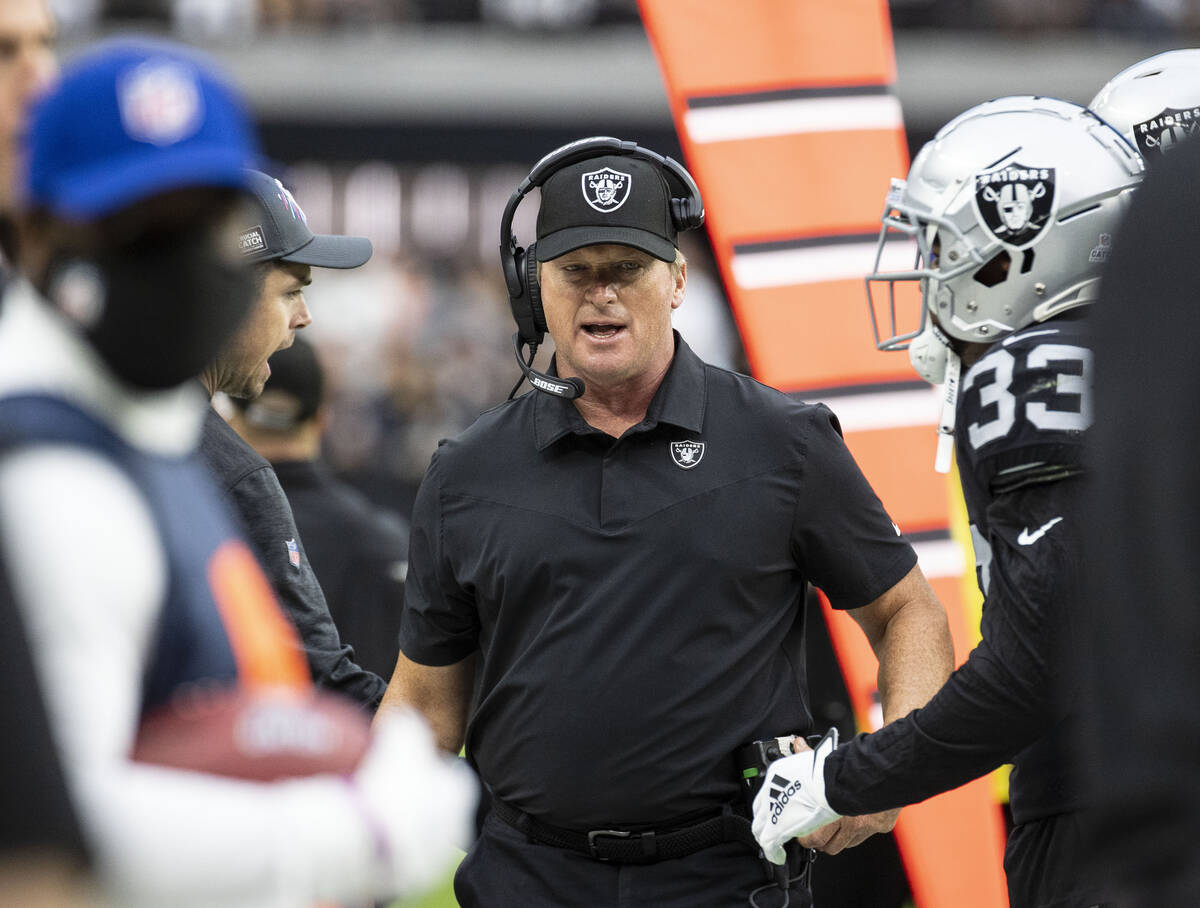 Raiders head coach Jon Gruden walks on the side line during the first half of an NFL football g ...