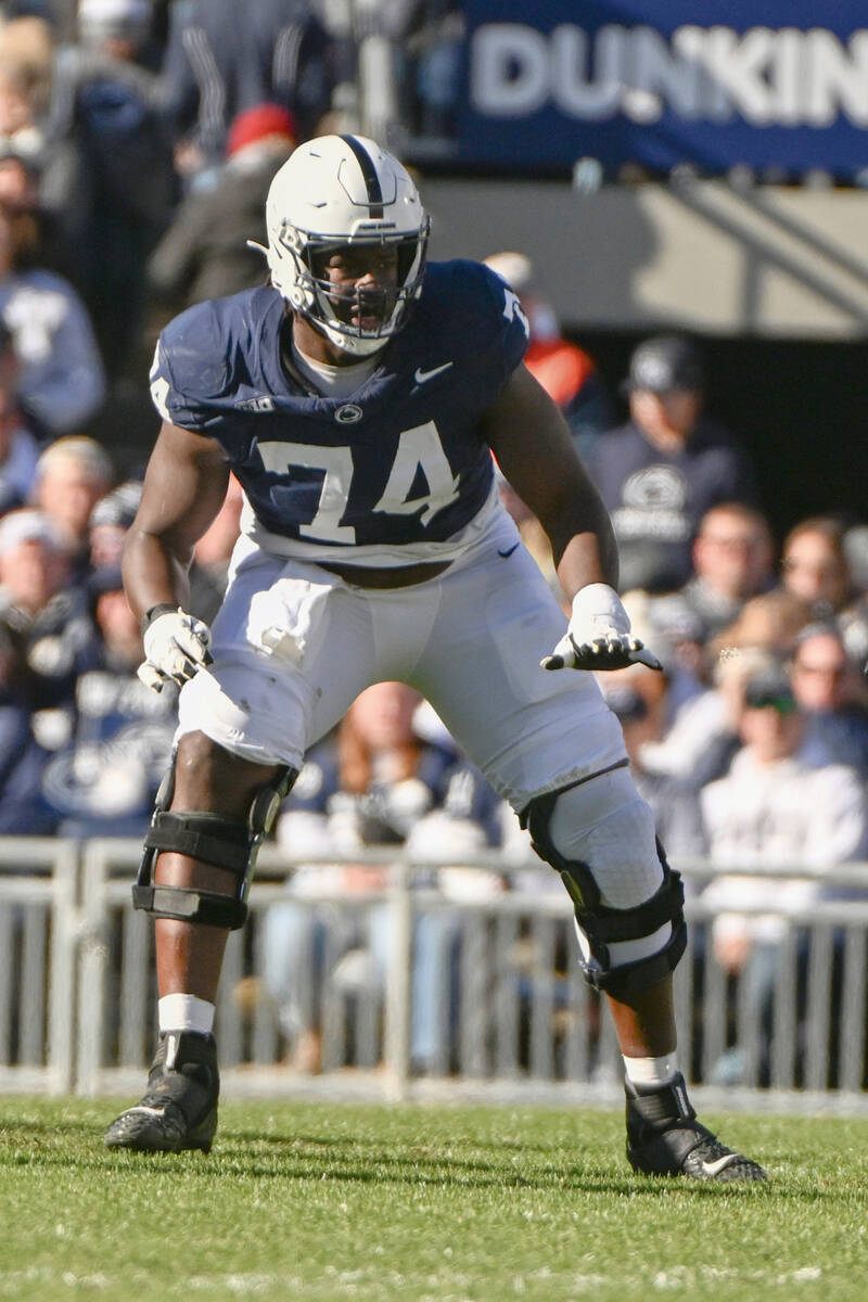 Penn State offensive lineman Olumuyiwa Fashanu (74) pass blocks against Rutgers during the firs ...